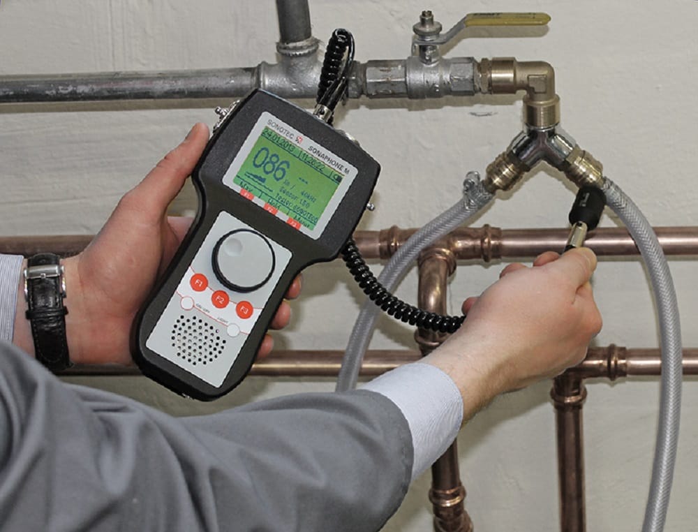 Plumber testing pipes with electronic leak detection equipment in Plant City